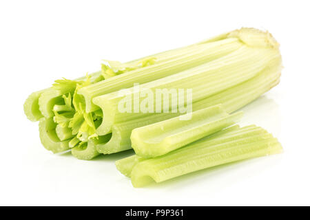 Fresh green celery with three sliced sticks isolated on white background Stock Photo