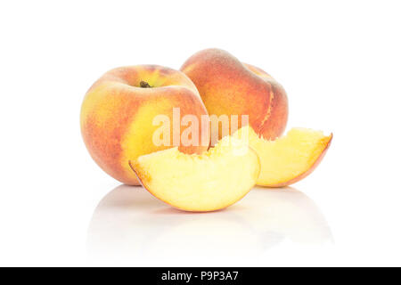 Ripe yellow peaches with two slices isolated on white background Stock Photo