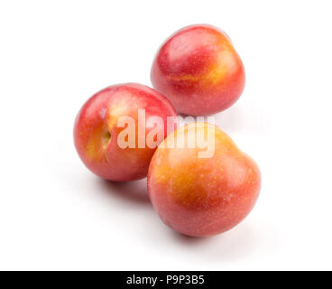 Three plums red orange isolated on white background Stock Photo