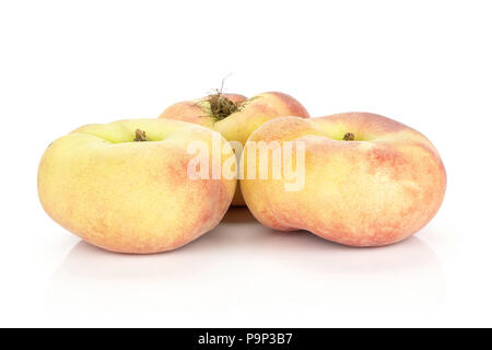Three fresh ripe Saturn peaches isolated on white background Stock Photo