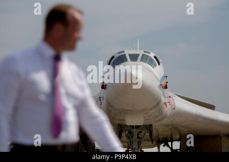 Visitor of the show walks near the Tupolev Tu-160 of Russian Air Force at MAKS-2015 airshow near Zhukovsky, Moscow Region, Russia Stock Photo