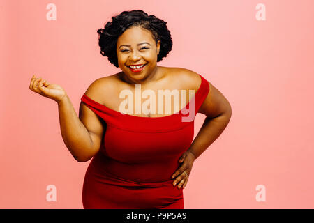 Happy beautiful plus size model smiling Stock Photo