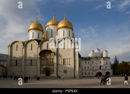 Golden domes of Dormition cathedral Moscow Kremlin in Red Square Russia with beautiful blue sky background Stock Photo
