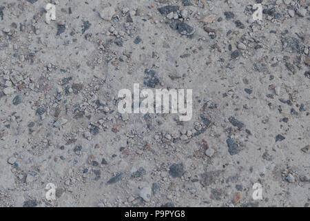 Concrete background with stone impregnations and sand. Stock Photo