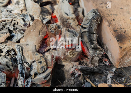 Burning coals at night ,Decaying charcoal, barbeque season. Stock Photo