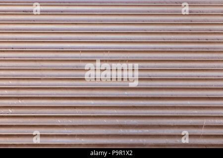 Venetian Jalousie blinds, with warm orange sun flares coming through, soft closeup. Stock Photo