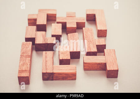 Abstract Background. Different shapes wooden blocks on white background. Concept of creative, logical thinking or problem solving. Toned photo Stock Photo