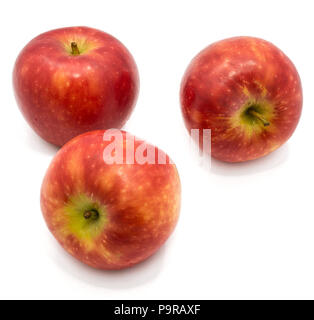 Three whole red Kanzi apples isolated on white background Stock Photo
