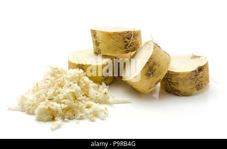 Freshly grated mash of horseradish root and sliced circles isolated on white background Stock Photo