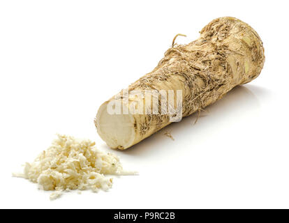 Freshly grated mash of horseradish root and one half isolated on white background Stock Photo