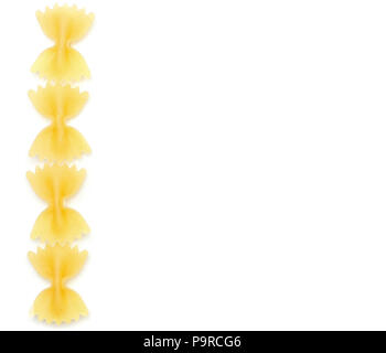 Four raw farfalle top view isolated on white background dry pasta pieces left side Stock Photo