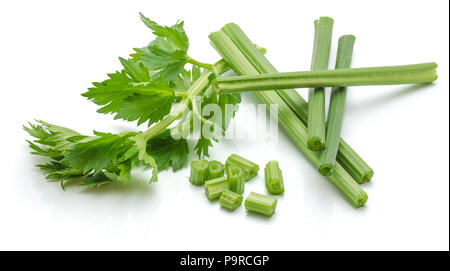 Sliced fresh celery pieces, sticks and leaves, isolated on white background Stock Photo
