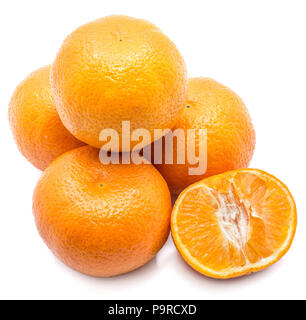 Four whole Clementines and one half isolated on white background Stock Photo