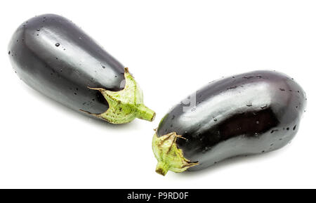 Two whole eggplants (aubergine) with water drops isolated on white background Stock Photo
