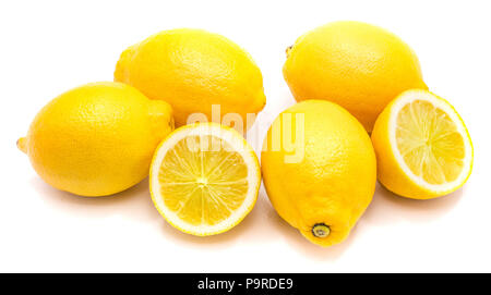 Group of whole yellow lemons and two halves isolated on white background Stock Photo