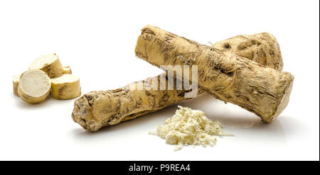 One whole, half and sliced circles, freshly grated mash of horseradish root, isolated on white background Stock Photo