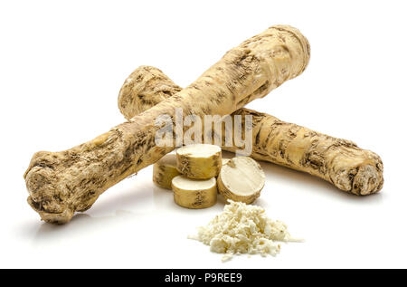 Two whole, one half, sliced circles and freshly grated mash of horseradish root, isolated on white background Stock Photo