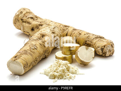 One whole, one half and freshly grated mash of horseradish root, isolated on white background, sliced circles Stock Photo