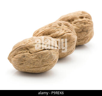 Unshelled walnuts isolated on white background three whole in row Stock Photo