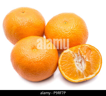 Three whole Clementines and one half isolated on white background Stock Photo