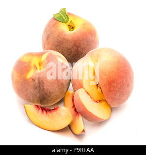 Three peaches, two whole, one cut open, three slices, isolated on white background Stock Photo