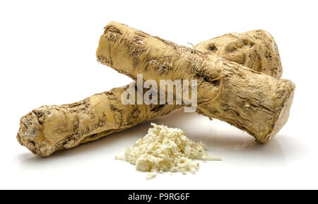 One whole, half and freshly grated mash of horseradish root, isolated on white background Stock Photo