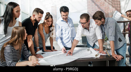 businessman discussing with the design team new sketches Stock Photo