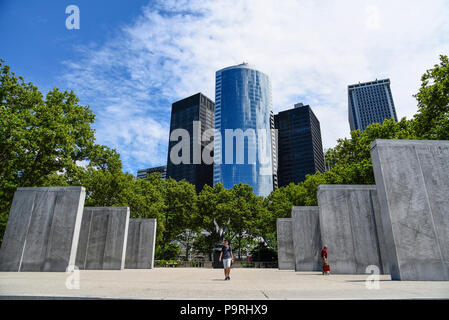 New York City, USA - June 20, 2018: East Coast Memorial against skyscrapers in Battery Park. This memorial honors the  missing American servicemen who Stock Photo