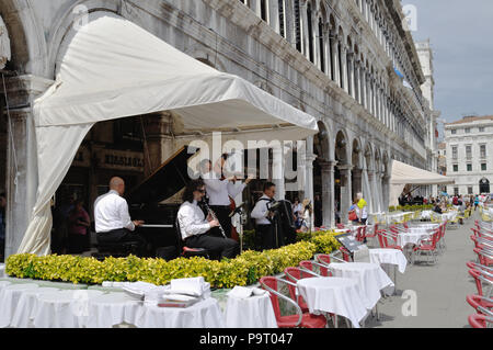 Band playing outside Gran Caffe Quadri in St Mark's Square, Venice Stock Photo