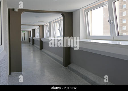 Newly enclosed access decks at Wilmcote House, Portsmouth, UK. 1968 built social housing blocks recently refurbished to EnerPHit energy standard Stock Photo