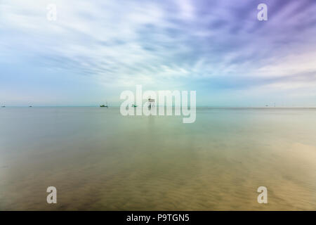 Dawn on the beach clam farm in the western coastal region of Vietnam with a small guardhouse before the beauty of nature create idyllic coastal Stock Photo