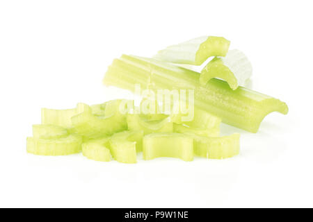 Three fresh green celery sticks and chopped sliced pieces stack isolated on white background Stock Photo