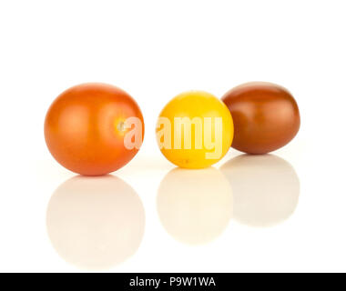 Three grape cherry tomatoes mix isolated on white background yellow black red Stock Photo