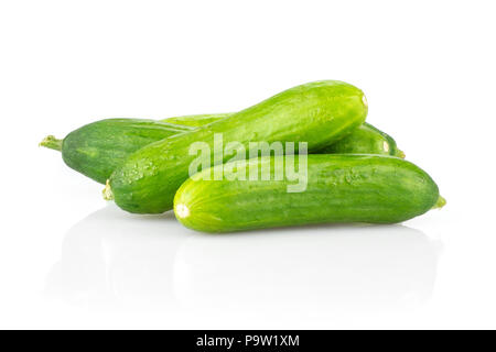 Three fresh green mini cucumbers set isolated on white background Stock Photo