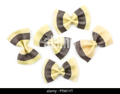 Farfalle pasta with black cuttlefish ink isolated on white background top view raw classic traditional Italian five pieces Stock Photo
