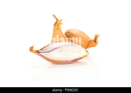 Two unpeeled shallots with one sliced half isolated on white background Stock Photo