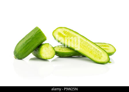 Sliced fresh green mini cucumbers halves isolated on white background Stock Photo