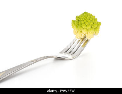 Green Romanesco cauliflower one piece impaled on a fork isolated on white background Stock Photo