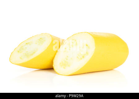 Group of two halves of raw yellow zucchini one cut in halves isolated on white Stock Photo