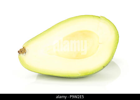 One green smooth avocado half without seed isolated on white background bacon variety Stock Photo