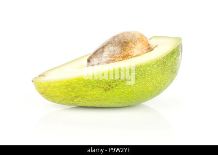 One green smooth avocado half with a brown seed isolated on white background bacon variety Stock Photo