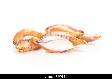 Golden shallots and one sliced half isolated on white background Stock Photo