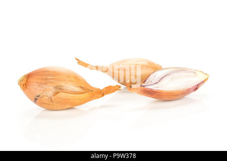 Two unpeeled shallots with one half isolated on white background Stock Photo
