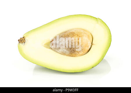 One green smooth avocado half with a seed isolated on white background bacon variety Stock Photo