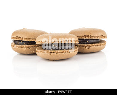 Chocolate French macarons isolated on white background three Stock Photo