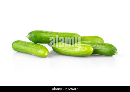 Five fresh green mini cucumbers isolated on white background Stock Photo