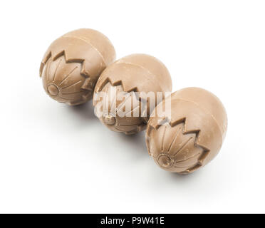 Chocolate eggs three in row isolated on white background Stock Photo