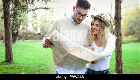 Tourist couple using map as guide Stock Photo