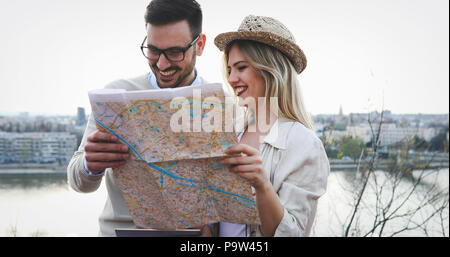 Tourist couple using map as guide Stock Photo