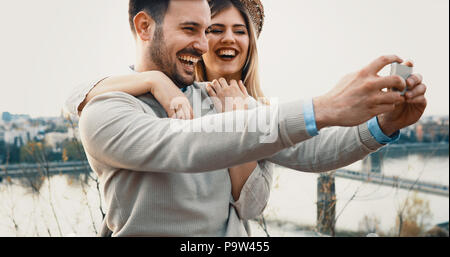 Couple in love taking selfies while traveling Stock Photo